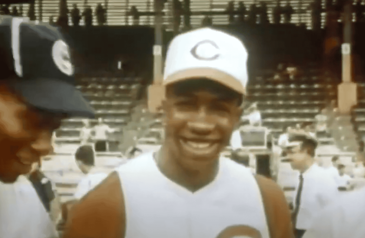 Frank Robinson in action, showcasing his skill and impact in MLB history.